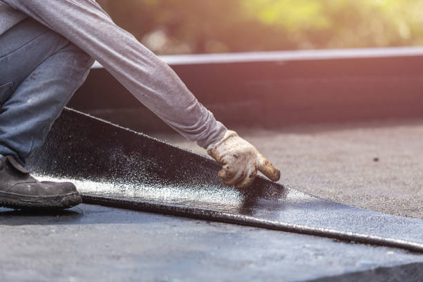 Professional Waterproofing technician working in Sand Lake, MI